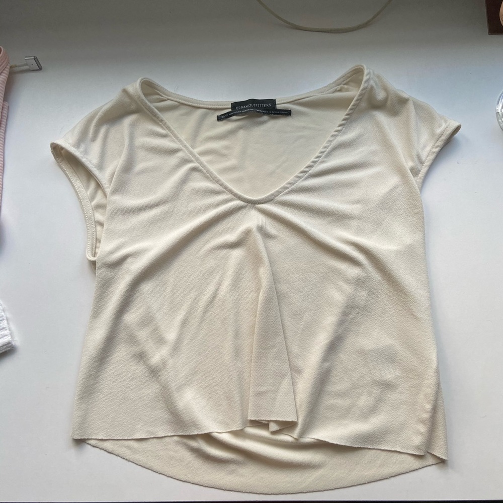 Raw hemmed, slightly cropped top